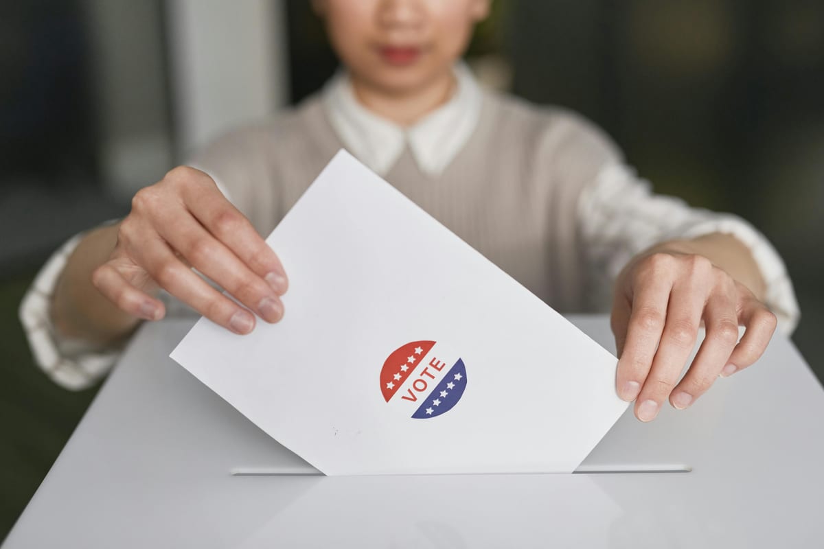 Person casting a ballot on Election Day